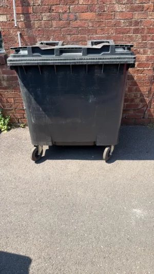 Secondhand 1100L Standard Plastic Wheelie Bin in Black