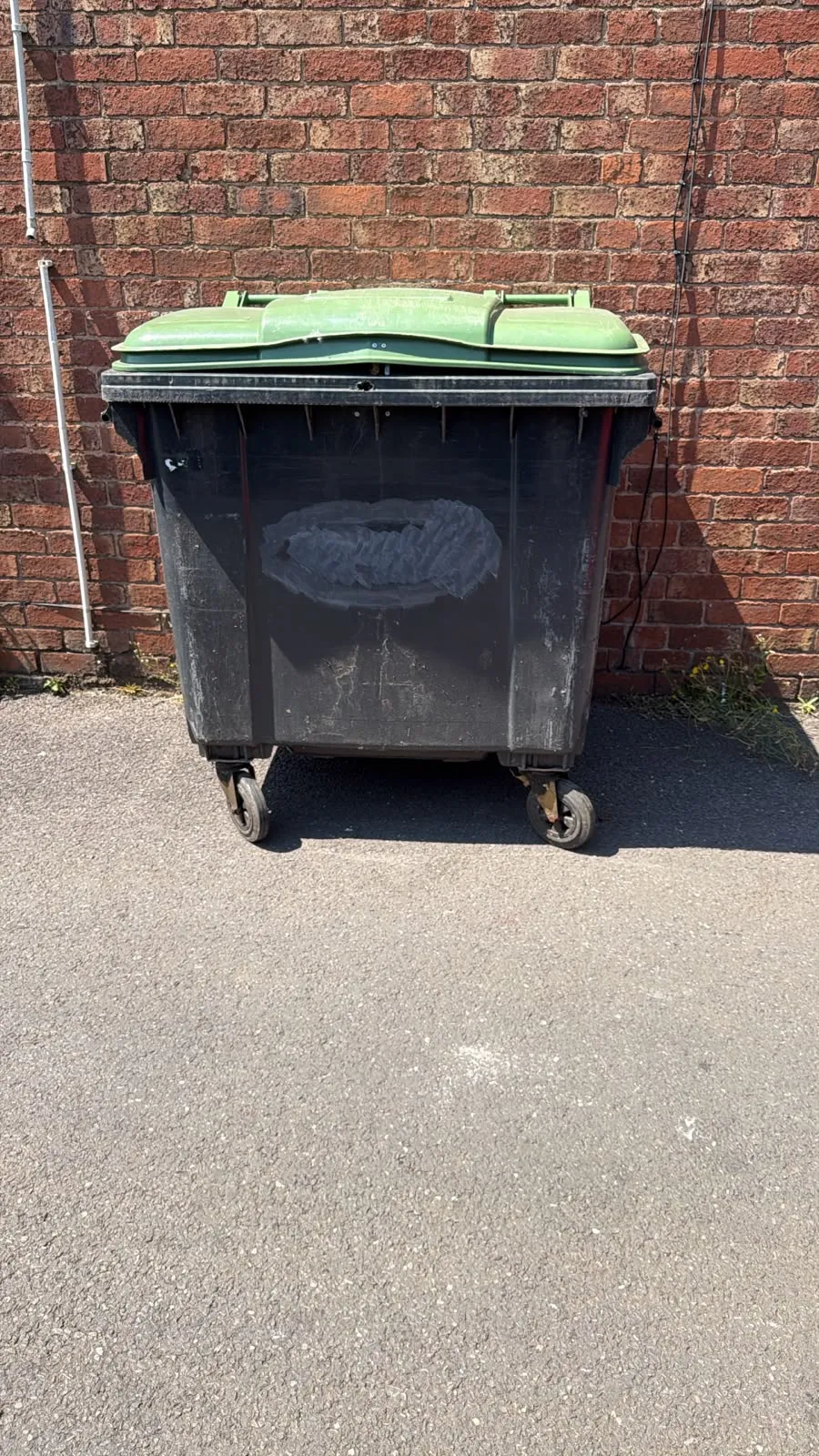Secondhand 1100L Plastic Wheelie Bin in Black with Green Lid