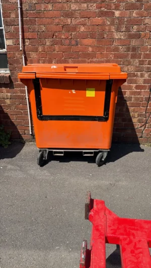Secondhand 770L Plastic Wheelie Bin in Orange with Drop Front & Fork Pockets